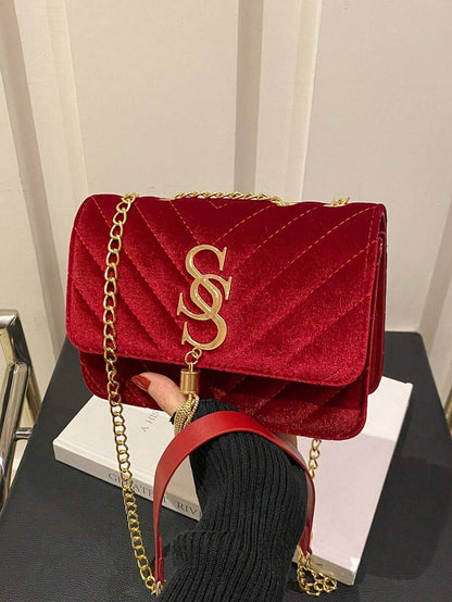 Refined Embossed Letter Shoulder Bag – New Year Collection displayed in red with gold chain.