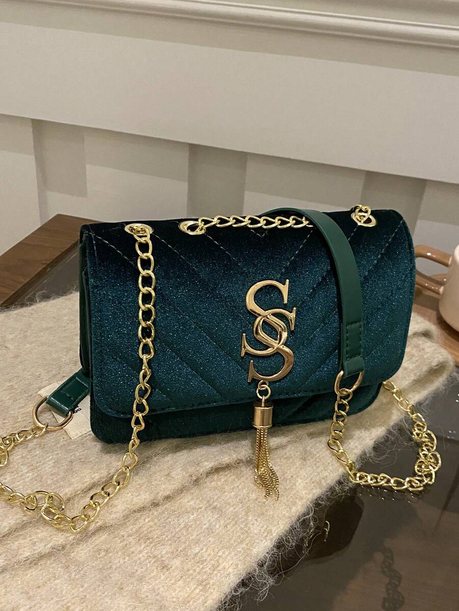 Refined Embossed Letter Shoulder Bag – New Year Collection in teal with gold chain and embossed detailing.