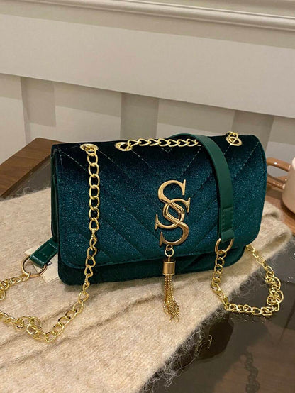 Refined Embossed Letter Shoulder Bag – New Year Collection in teal with gold chain and embossed detailing.