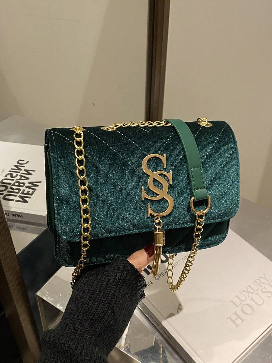 Refined Embossed Letter Shoulder Bag – New Year Collection in green with gold chain and logo detail.