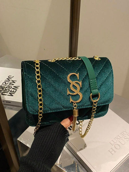 Refined Embossed Letter Shoulder Bag – New Year Collection in green with gold chain and logo detail.
