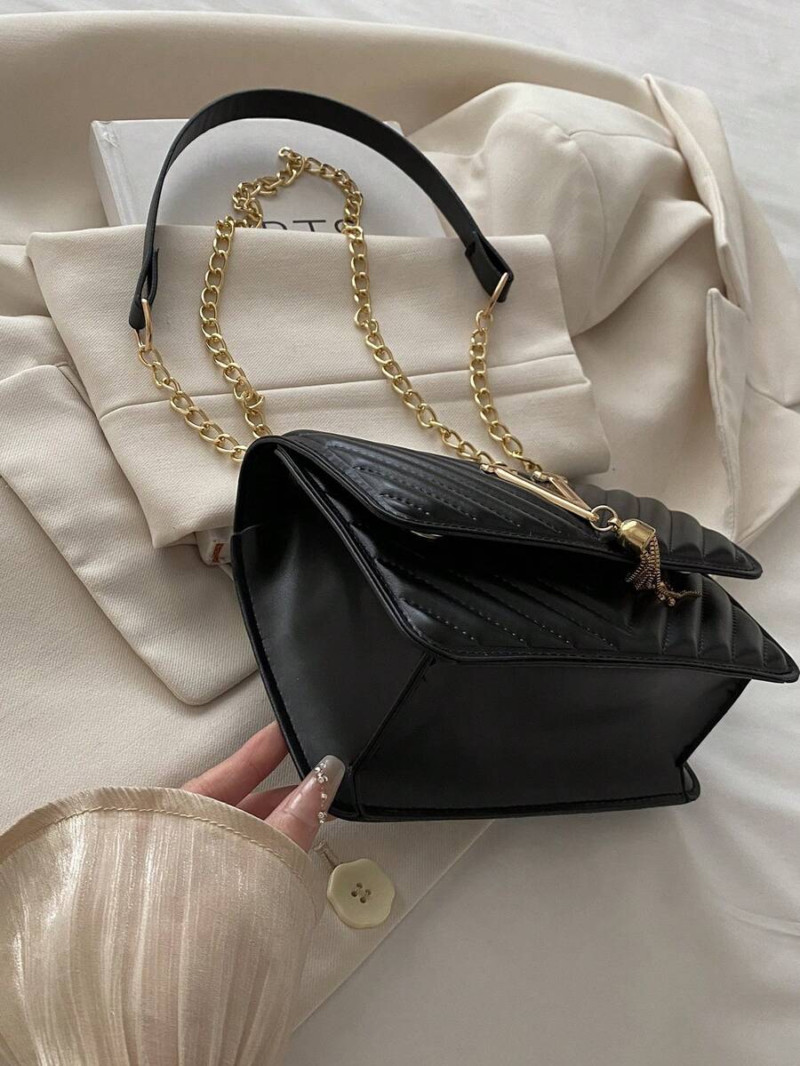 Refined Embossed Letter Shoulder Bag – New Year Collection featuring elegant design and gold chain strap.