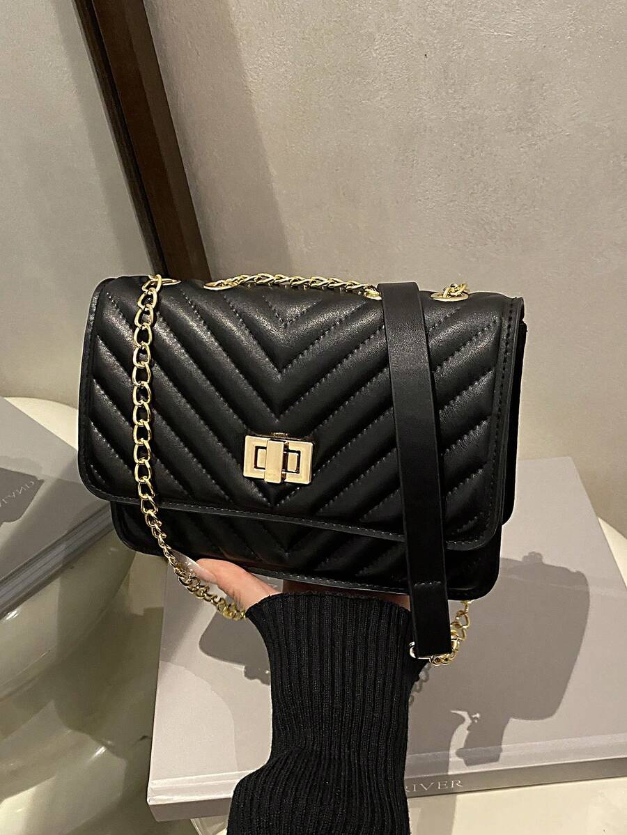 Refined Embossed Letter Shoulder Bag – New Year Collection, stylish black shoulder crossbody bag with quilted design.