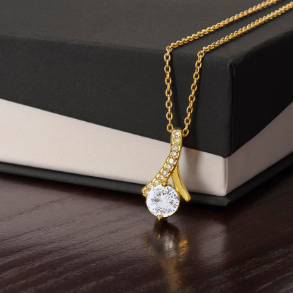 Close-up of Forever Curve Love Necklace, featuring a sparkling cubic zirconia pendant on a gold chain.