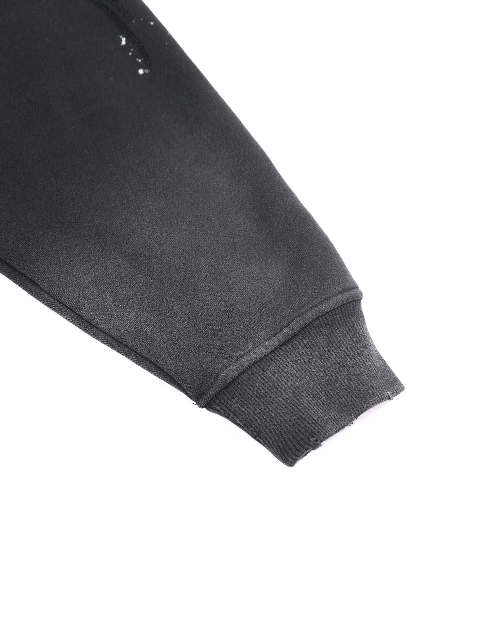 Detail of URBANOVA-Acid Washed Fleece Hoodie sleeve showcasing cotton material and distressed features.