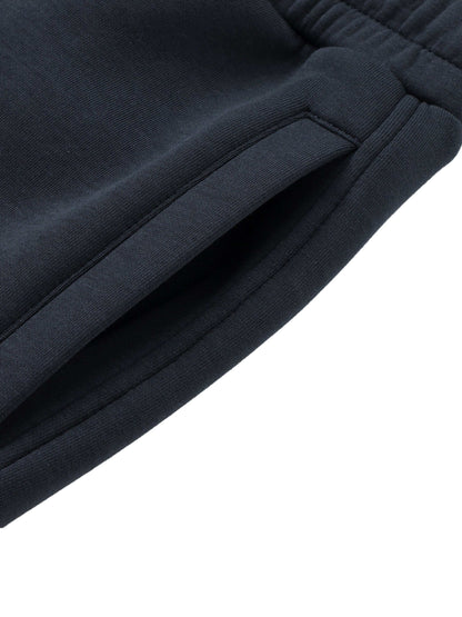 Urbanova Noir Essential Joggers close-up view showing pocket and fabric detail in black color.