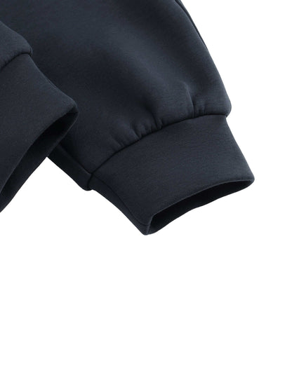 Urbanova Noir Essential Joggers close-up of sleeve cuffs in black fabric showcasing regular fit and premium qualities.