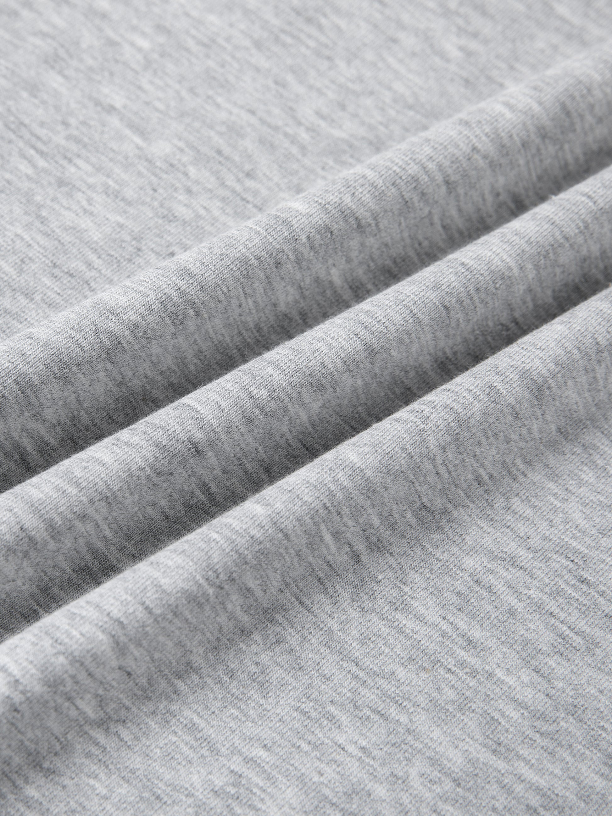 Close-up of soft cotton-blend fabric showcasing the texture of the Urbanova Essential Crew Tee.