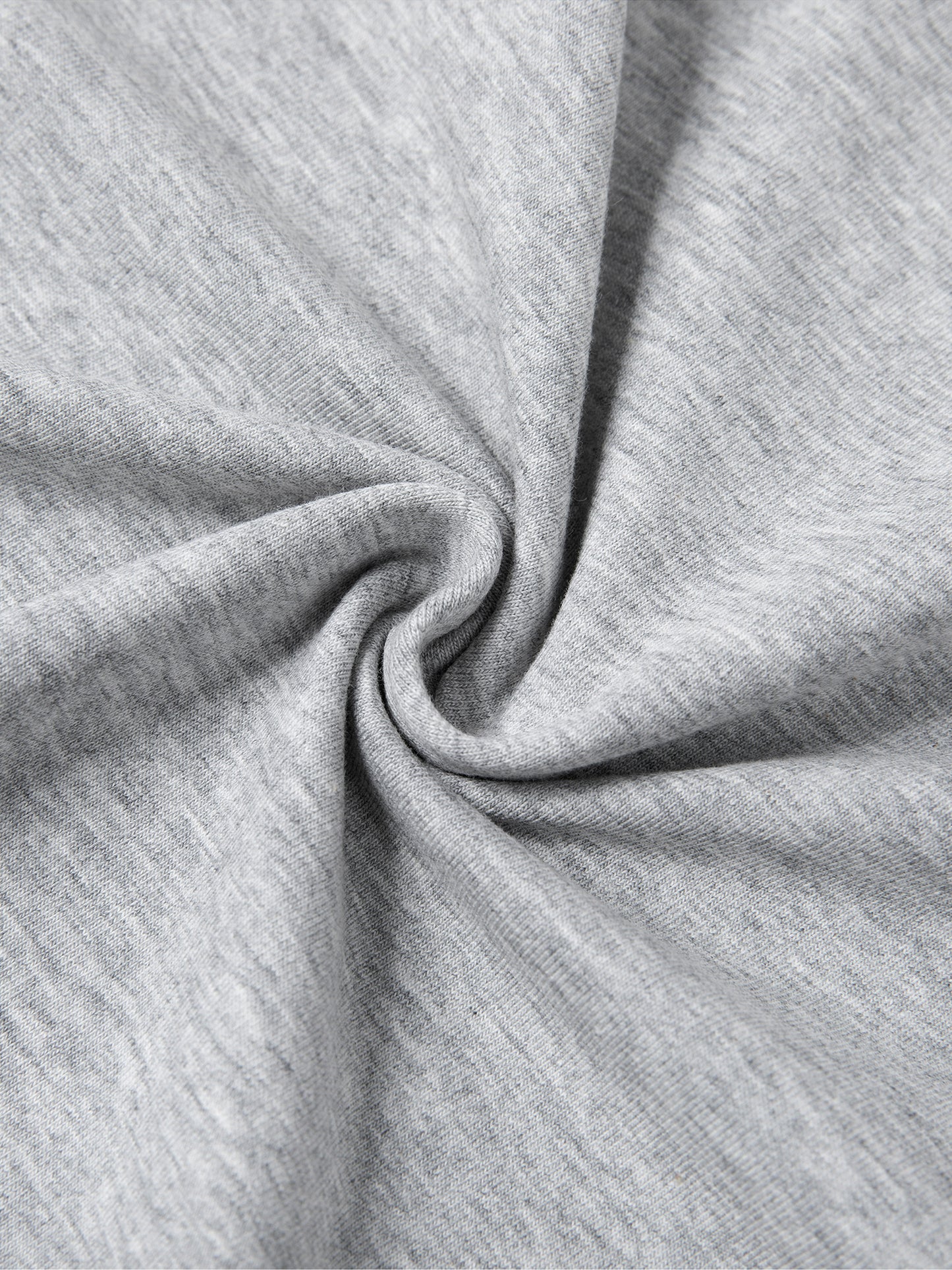 Close-up of soft grey fabric showcasing the quality of the Urbanova Essential Crew Tee.