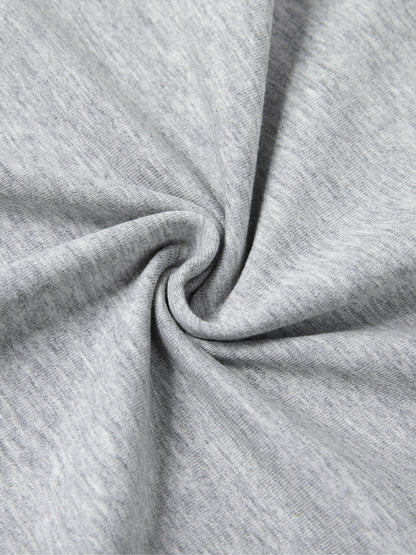 Close-up of soft grey fabric showcasing the quality of the Urbanova Essential Crew Tee.
