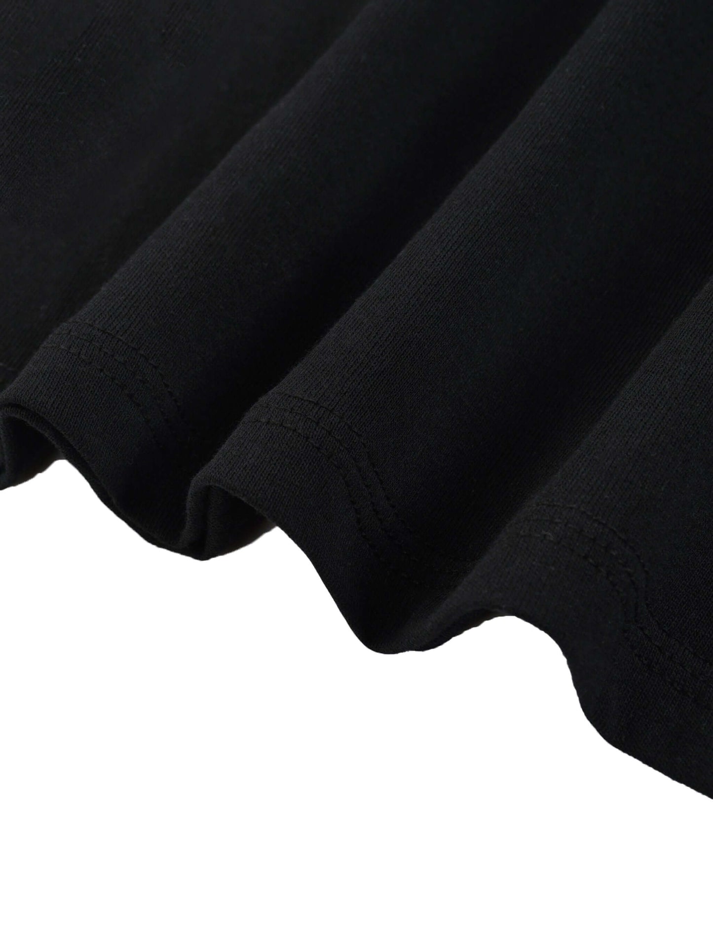 Close-up of the hem and fabric texture of a Lightweight Cotton Classic Fit T-Shirt in black.