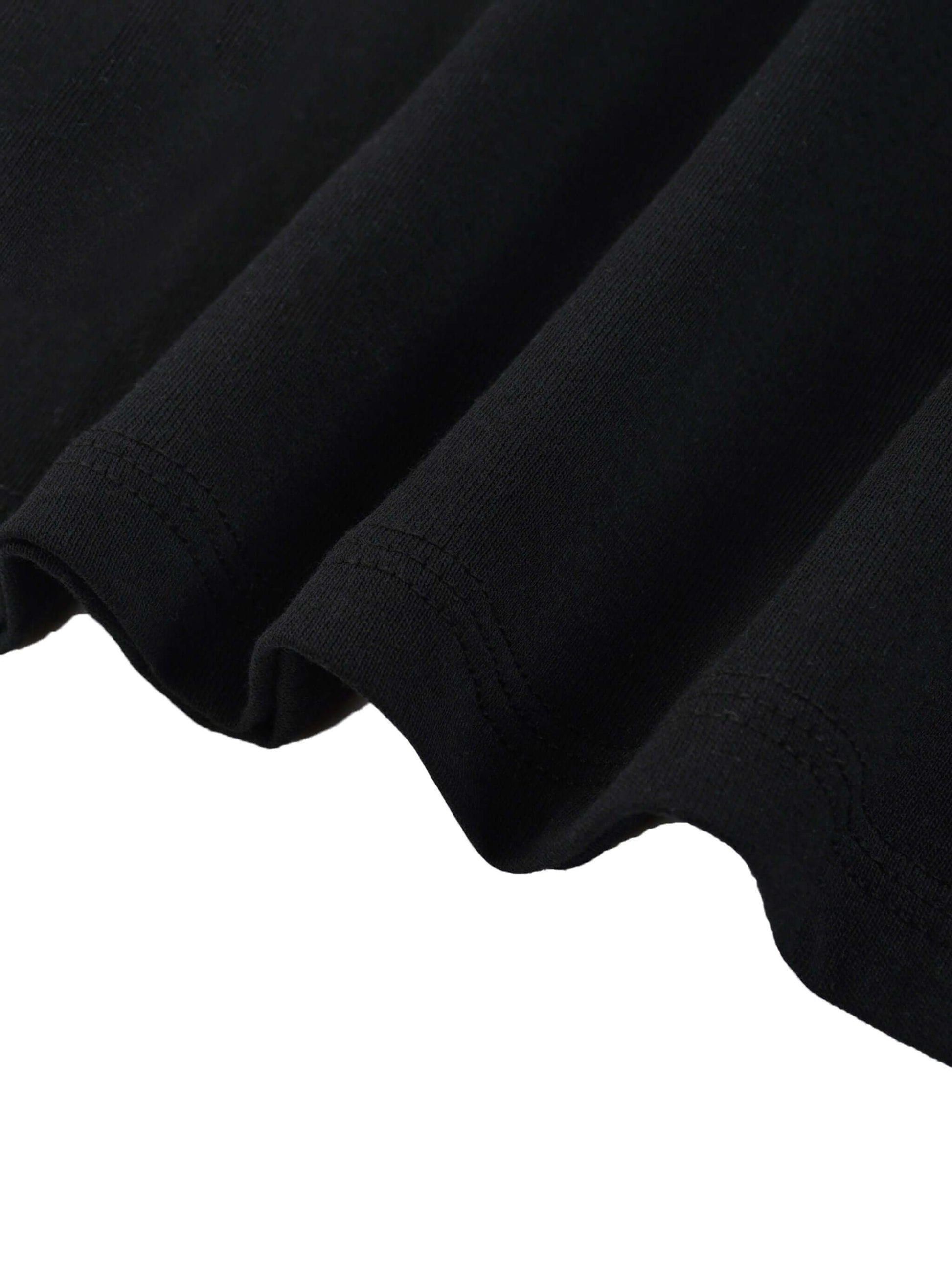 Close-up of the hem and fabric texture of a Lightweight Cotton Classic Fit T-Shirt in black.